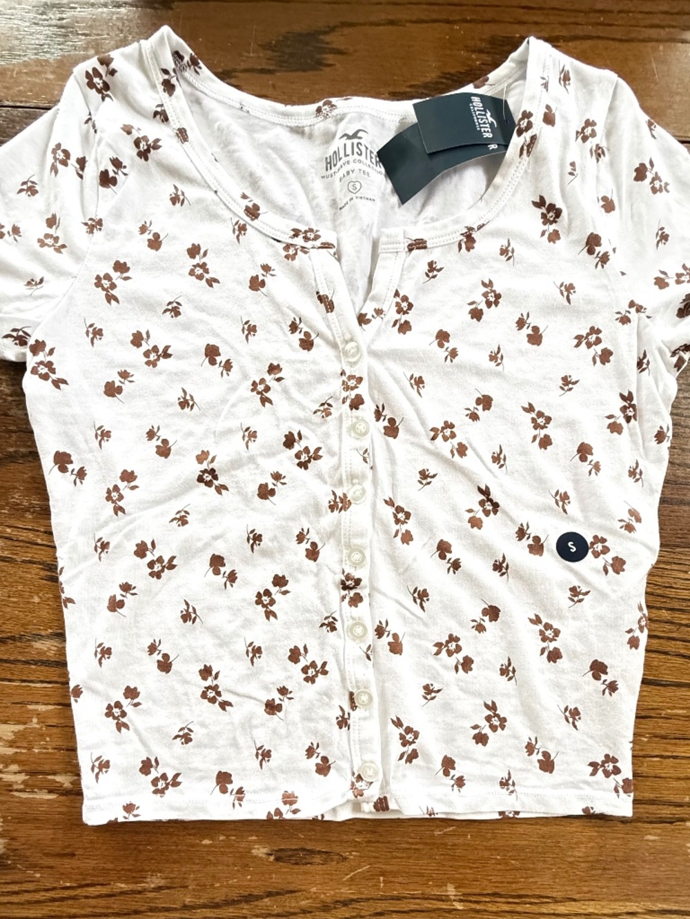 Womens Hollister whit w/ brown floral  “Must have baby tee”  NWT